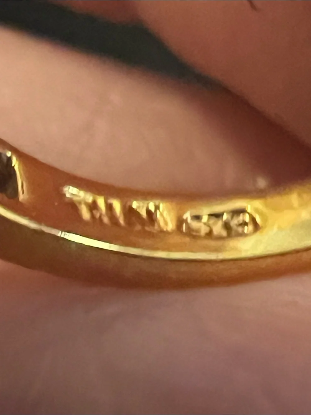 Gold Ring with Ruby-Red Center and Clear Accent Stones